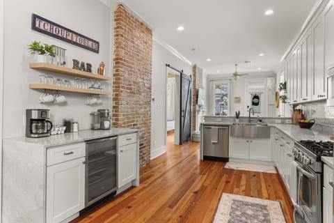 Coffee/cocktail bar with coffee machines and beverage fridge