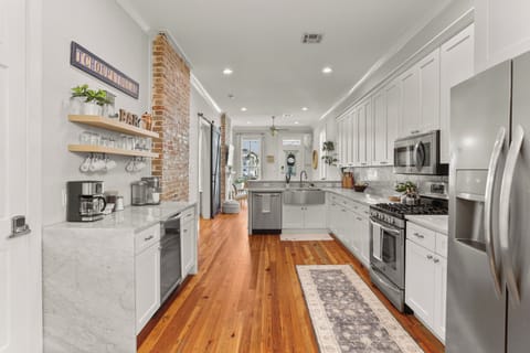 Fully stocked premium Kitchen w/ stainless appliances & coffee/cocktail bar area