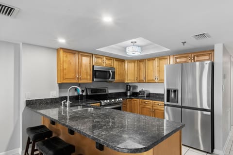 Fully Stocked Kitchen with Stainless Steel Appliances