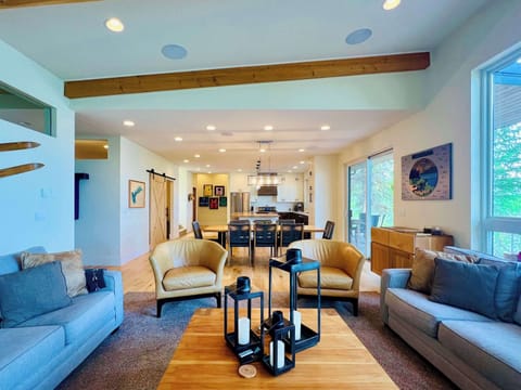 Living Room with sweeping lake views, gas fireplace, tv and sonos