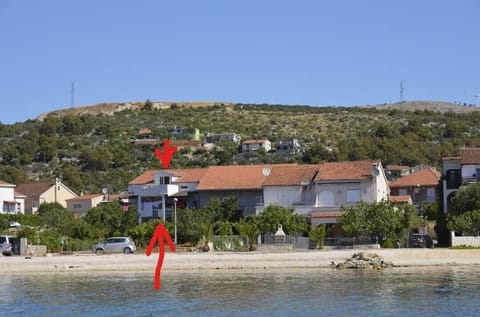 Area that directly surrounds the property. Distance from the first beach