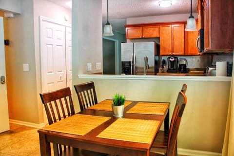 Dinette table sets 4 people where you can enjoy a meal or drinks beyond the kitchen that connects into the family room. 