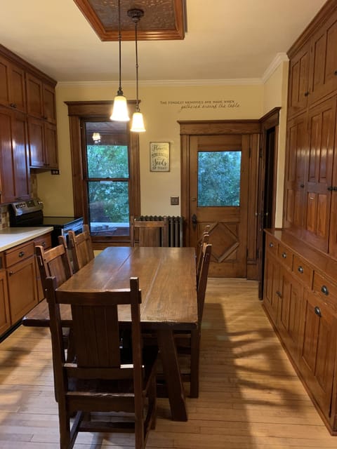 Kitchen with door to porch/patio grill area and door to second floor
