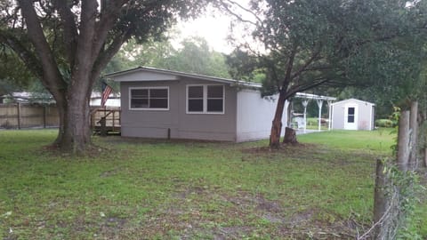 Front of La Fish Camp Cottage. River view behind.
