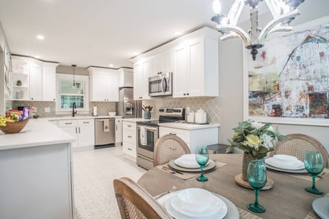 Stocked dream kitchen with loads of counter-space and cabinetry