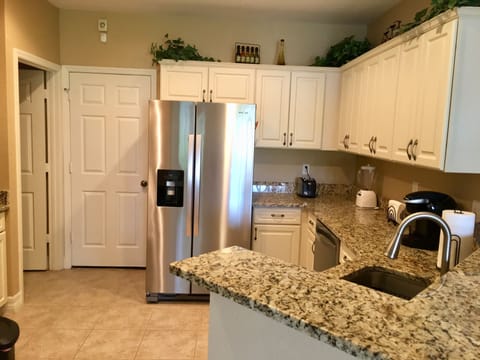 Updated and fully stocked Kitchen with all stainless appliances 