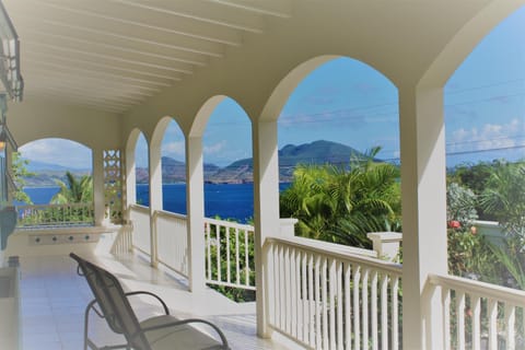 Eden Villa's Great House Entry Gallery.  St Kitts across the Narrows