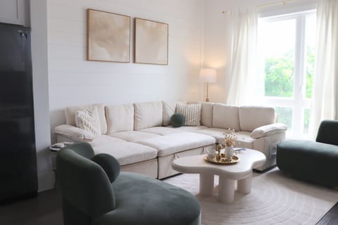 Stylish lounge w/ plush sofa and natural light. Perfect for groups and families.