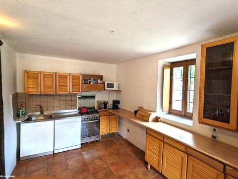Fully-equipped kitchen with ample workspace and dining area