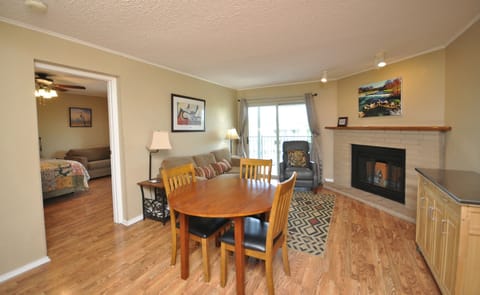 Centrally located dining table allows conversation with those in the living room.