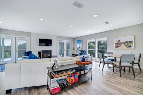 Large gathering area in the living room with a game table There are games avail