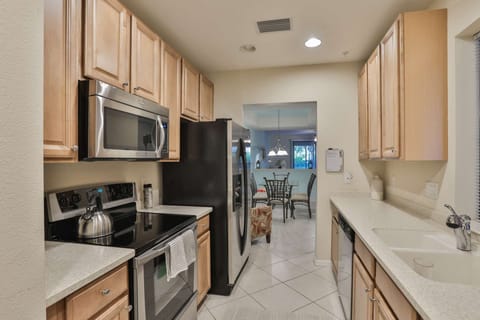 Kitchen leads to the dining area and spacious living room