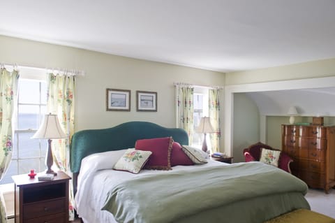 Master bedroom on second floor with king bed. Looking west. Views of lake.