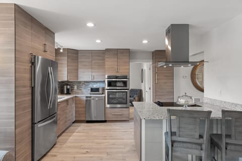 Modern kitchen with thoughtful lay-out for streamlined prep,  cooking and gathering.