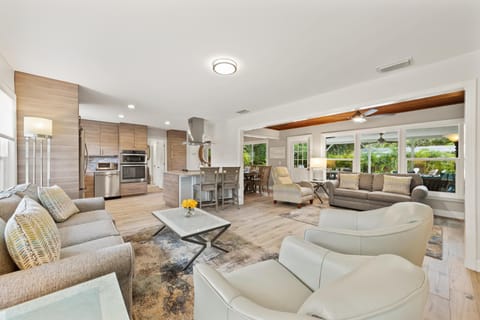 Living room opens seamlessly to kitchen and dining—ideal for together time.