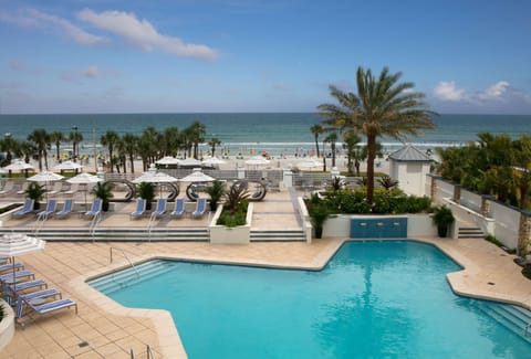 Breathe in ocean breezes from this palm-framed pool deck.