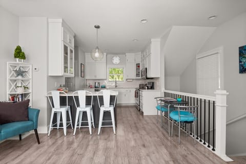 In addition to the bar stools and balcony seating, there's an extra table-for-two