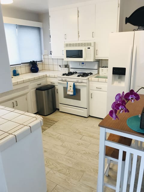 Kitchen with new appliances. Stove, Microwave, Dishwasher, Ice Maker    Fridge