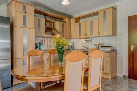 Cooking area - dining table with six high-back chairs