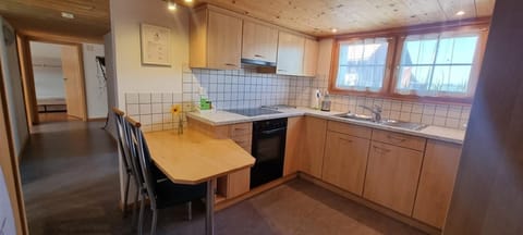 Kitchen with a view of the hallway