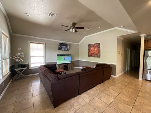 Living room with two televisions to watch multiple games at the same time. 