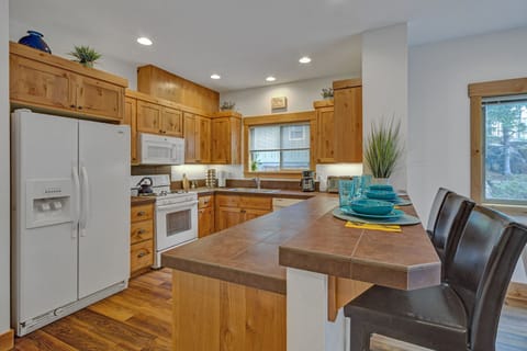 Three cozy bar chairs, in addition to dining room set that seats five more