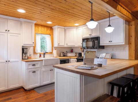 The farmhouse style kitchen is cheery and well-lit, the perfect stage for your next kitchen creation