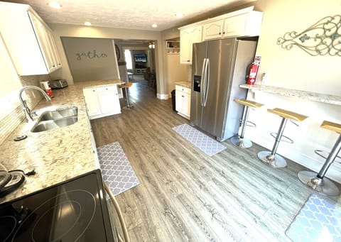 Large fridge with water/ice. 