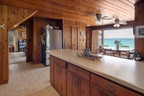 Kitchen with bar stools along the island for additional seating.