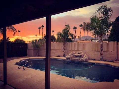 Private backyard pool at sunset. The pool is 8' deep and warm May to October