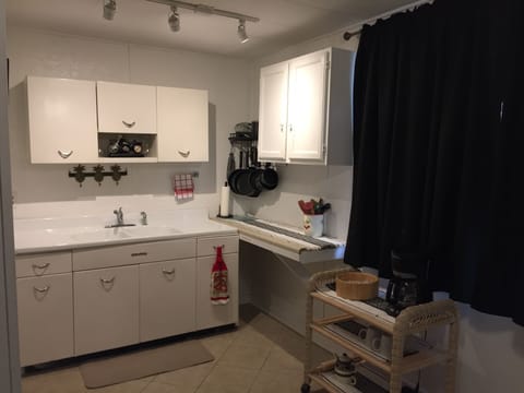 retro kitchen with pot/pan rack in corner