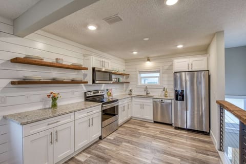 The private entrance of Barefoot Hideaway I leads up into this beautiful kitchen and living space!