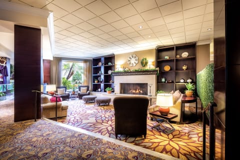 Settle into plush seating with warm light and garden views.