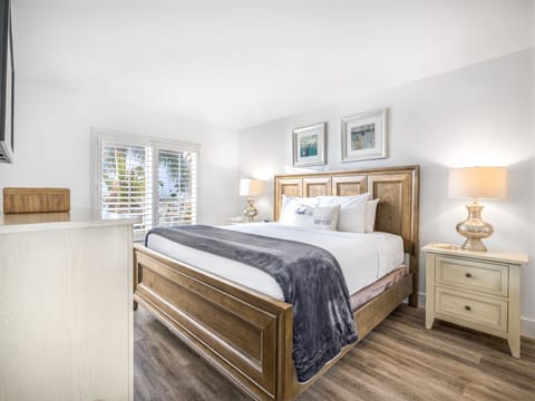 Sink into a plush king bed with calming coastal style.