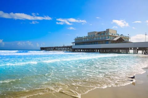 Breathe in salty air near the iconic pier and surf.