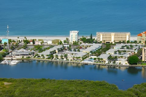Picture your stay nestled between bay waters and the beach.