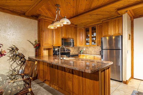 Upgraded Kitchen Features Granite Counter tops, Custom Cabinetry and Stainless Steel Appliances.