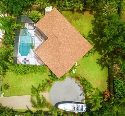 Ariel view of vacation home. That's a 32' boat in the drive to give perspective.