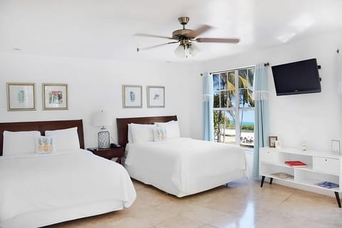 Breathe in beach views from plush beds and airy space.