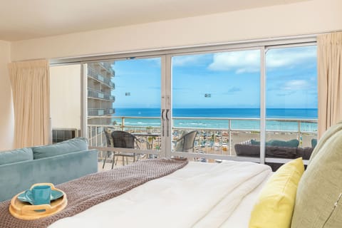 Experience serene ocean views from the comfort of your bed