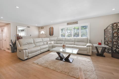 Livingroom and Leather couch with 3 built in recliners