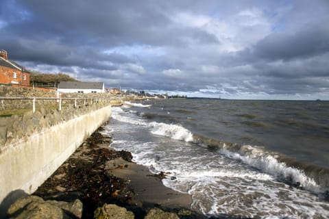 The Coastguard Boat House in the white building you see - beside the sea.