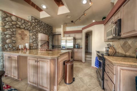 Beautiful kitchen. The gate in the kitchen leads to an owner's storage closet.