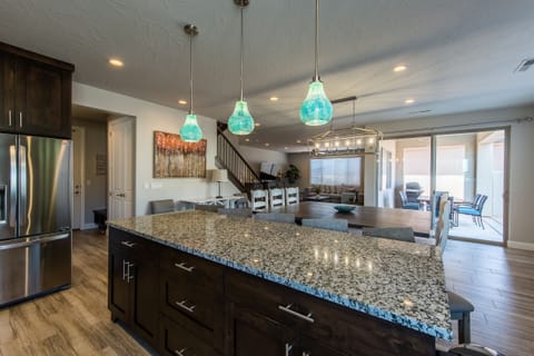 Kitchen Island, Dining Table, Patio Table and Living Room.
