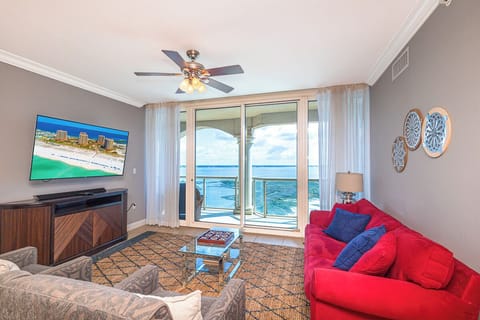 Relax in your bright living room with sweeping coastal views through floor-to-ceiling glass doors opening to your private balcony. Unwind on plush seating while enjoying coastal breezes.