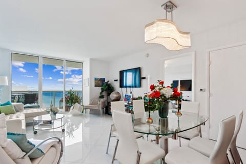 Ocean view Living room, L-shaped leather couch, smart tv, dining table seats 6-8