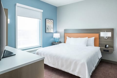 Sink into crisp linens for a deeply restful night’s sleep.