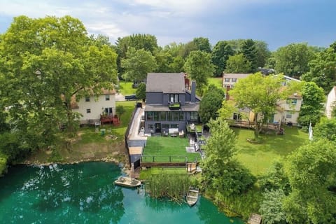 Spacious club house on pond with boats, private terrace, game rooms, and movie theatre.