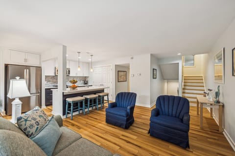 Living room with flat screen tv and a sofa bed.
