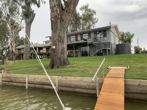 Beautiful holiday home with four queen beds, large deck & outdoor furniture.